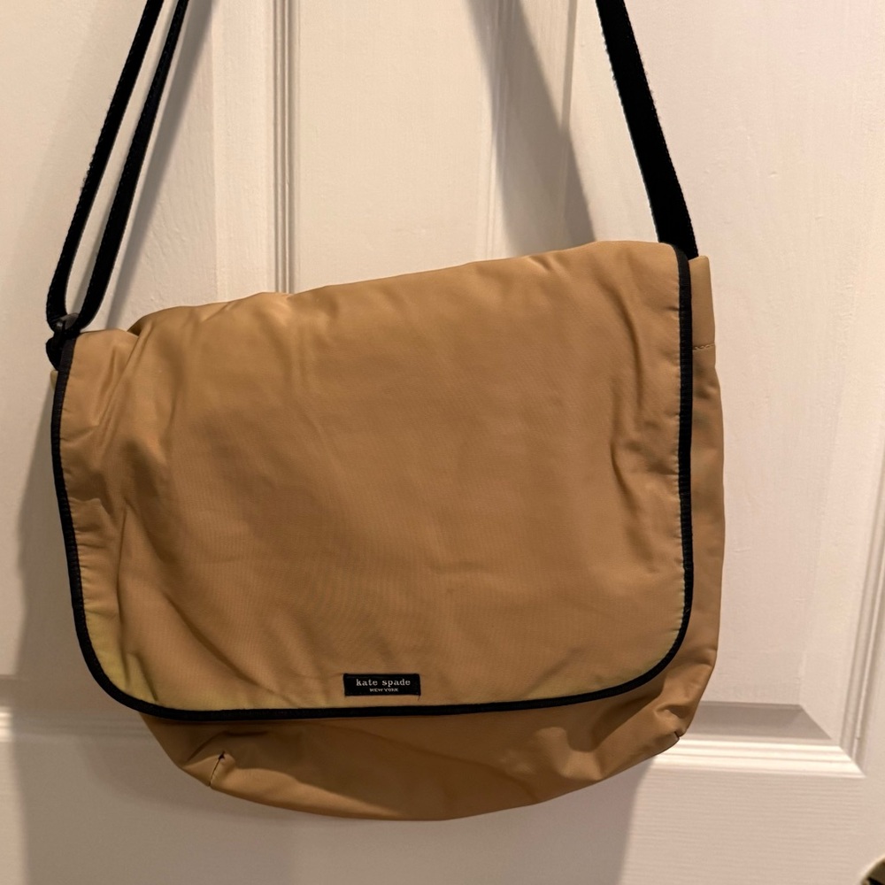 Small, tan Kate Spade messenger bag.